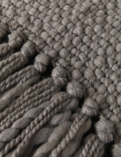 FLAMA HERITAGE THROW in Vison - Macro close-up of chunky knit wool texture and twisted tassels