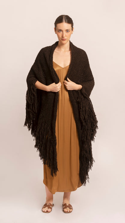 JUJUY THROW in Brown - Full length three-quarter view on female model against studio background