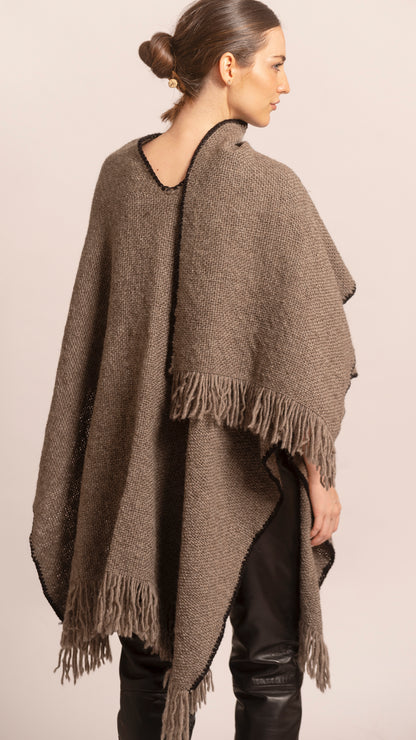 ORIGEN RUANA in Vison -  female model showing woven drape and fringed hem.